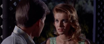 Movie still from “Bye Bye Birdie” (1963), directed by George Sidney – A young woman is talking to a young man; Close Up shot, Over the shoulder angle