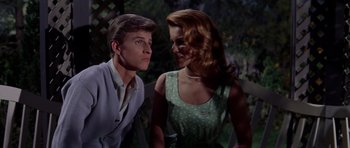 Movie still from “Bye Bye Birdie” (1963), directed by George Sidney – A man and a woman standing next to each other; Medium shot, Low angle