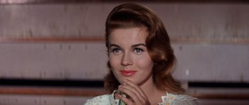 Movie still from “Bye Bye Birdie” (1963), directed by George Sidney – A beautiful woman with brown hair wearing a white dress; Close Up shot, Low angle