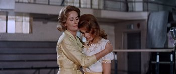Movie still from “Bye Bye Birdie” (1963), directed by George Sidney – A woman and a young girl embracing each other; Medium shot, Low angle