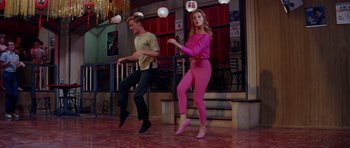 Movie still from “Bye Bye Birdie” (1963), directed by George Sidney – A man and a woman are dancing on the floor; Wide shot, Low angle