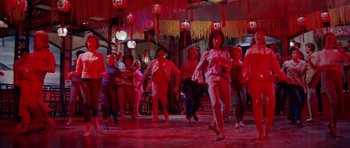 Movie still from “Bye Bye Birdie” (1963), directed by George Sidney – A group of people are dancing in a red room; Wide shot, High angle