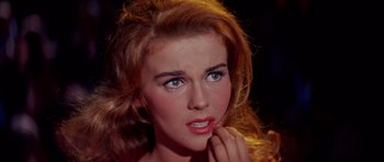 Movie still from “Bye Bye Birdie” (1963), directed by George Sidney – A person wearing a dress; Close Up shot, Over the shoulder angle