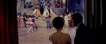 Movie still from “Bye Bye Birdie” (1963), directed by George Sidney – A group of people standing in front of a crowd; Wide shot, Over the shoulder angle