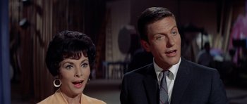 Movie still from “Bye Bye Birdie” (1963), directed by George Sidney – A man and a woman standing next to each other in a room; Close Up shot, Low angle