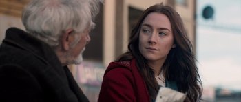 Movie still from “Byzantium” (2012), directed by Neil Jordan – A woman in a red jacket is talking to an older man; Close Up shot, Over the shoulder angle