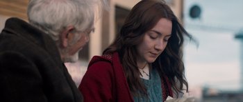 Movie still from “Byzantium” (2012), directed by Neil Jordan – A young woman is looking down at her cell phone; Close Up shot, Over the shoulder angle