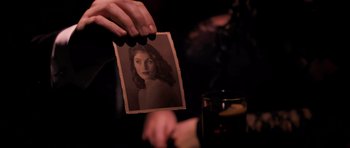 Movie still from “Byzantium” (2012), directed by Neil Jordan – A person holding up an old photo of a woman; Extreme Close Up shot, Over the shoulder angle