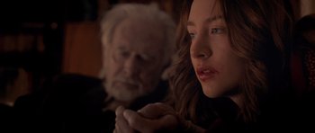 Movie still from “Byzantium” (2012), directed by Neil Jordan – A young woman and an older man are looking at the camera; Close Up shot, Over the shoulder angle