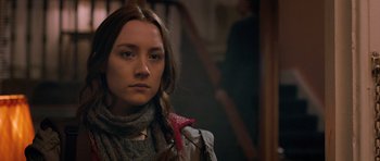 Movie still from “Byzantium” (2012), directed by Neil Jordan – A young woman with long brown hair wearing a scarf; Close Up shot, Over the shoulder angle