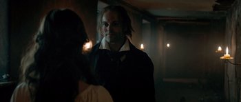 Movie still from “Byzantium” (2012), directed by Neil Jordan – A man in a black shirt is looking at a woman in a white dress; Close Up shot, Over the shoulder angle