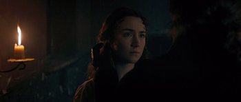 Movie still from “Byzantium” (2012), directed by Neil Jordan – A young woman with long red hair is looking at the camera; Close Up shot, Over the shoulder angle