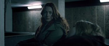 Movie still from “Byzantium” (2012), directed by Neil Jordan – A person sitting in a room; Medium shot, Over the shoulder angle