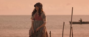 Movie still from “Byzantium” (2012), directed by Neil Jordan – A young woman holding a stick near the ocean; Medium shot, High angle