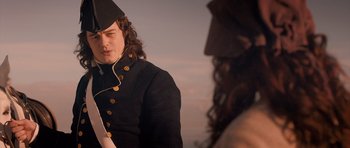 Movie still from “Byzantium” (2012), directed by Neil Jordan – A man in a military uniform talking to a woman; Medium shot, Over the shoulder angle