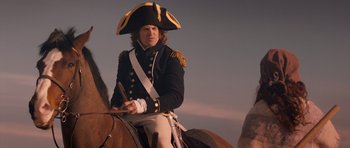 Movie still from “Byzantium” (2012), directed by Neil Jordan – A man in a uniform sitting on top of a horse; Medium shot, Low angle