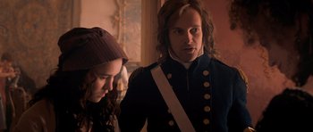 Movie still from “Byzantium” (2012), directed by Neil Jordan – A man and a woman are standing next to each other; Medium shot, Over the shoulder angle