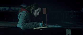Movie still from “Byzantium” (2012), directed by Neil Jordan – A woman is writing in a notebook at night; Close Up shot, Over the shoulder angle