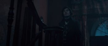 Movie still from “Byzantium” (2012), directed by Neil Jordan – A man standing in front of a wooden railing; Medium shot, Low angle