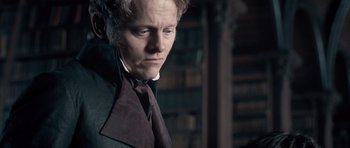 Movie still from “Byzantium” (2012), directed by Neil Jordan – A person wearing a suit and tie; Close Up shot, Over the shoulder angle