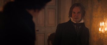 Movie still from “Byzantium” (2012), directed by Neil Jordan – A man in a black jacket standing in front of a door; Close Up shot, Over the shoulder angle