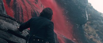 Movie still from “Byzantium” (2012), directed by Neil Jordan – A person standing in front of a wall of red paint; Wide shot, High angle