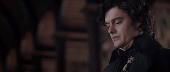 Movie still from “Byzantium” (2012), directed by Neil Jordan – A person wearing a suit and tie; Close Up shot, Low angle