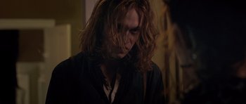 Movie still from “Byzantium” (2012), directed by Neil Jordan – A person with long curly hair; Close Up shot, Over the shoulder angle