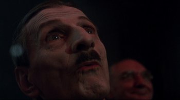 Movie still from “Cabaret” (1972), directed by Bob Fosse – A person with a mustache; Close Up shot, Low angle