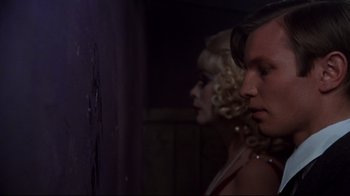 Movie still from “Cabaret” (1972), directed by Bob Fosse – A man and a woman standing next to each other; Close Up shot, Over the shoulder angle