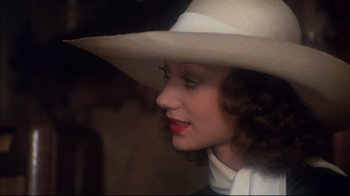 Movie still from “Cabaret” (1972), directed by Bob Fosse – A person wearing a cowboy hat; Close Up shot, High angle