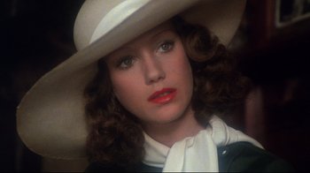 Movie still from “Cabaret” (1972), directed by Bob Fosse – A person wearing a hat; Close Up shot, High angle