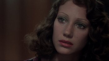 Movie still from “Cabaret” (1972), directed by Bob Fosse – A woman's face with green eyes; Close Up shot, High angle