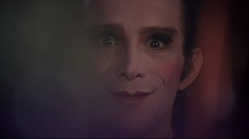 Movie still from “Cabaret” (1972), directed by Bob Fosse – A person's face with makeup on; Extreme Close Up shot, Over the shoulder angle