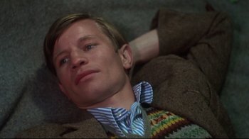 Movie still from “Cabaret” (1972), directed by Bob Fosse – A person laying on the ground; Close Up shot, High angle