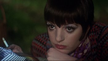 Movie still from “Cabaret” (1972), directed by Bob Fosse – A person wearing a scarf; Close Up shot, High angle
