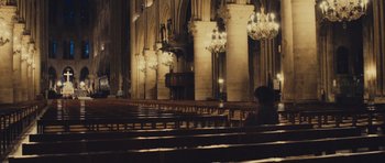 Movie still from “Café de Flore” (2011), directed by Jean-Marc Vallée – A person is sitting in a large church; Extreme Wide shot, High angle