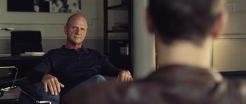 Movie still from “Café de Flore” (2011), directed by Jean-Marc Vallée – An older man sitting in front of a mirror; Close Up shot, Over the shoulder angle
