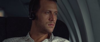 Movie still from “Café de Flore” (2011), directed by Jean-Marc Vallée – A person wearing a headset; Close Up shot, Low angle