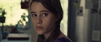 Movie still from “Café de Flore” (2011), directed by Jean-Marc Vallée – A young girl is looking into the distance; Close Up shot, Over the shoulder angle