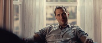 Movie still from “Café de Flore” (2011), directed by Jean-Marc Vallée – A person sitting on a couch; Close Up shot, Over the shoulder angle