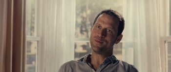 Movie still from “Café de Flore” (2011), directed by Jean-Marc Vallée – A person sitting in a room; Close Up shot, Over the shoulder angle