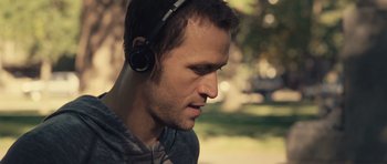 Movie still from “Café de Flore” (2011), directed by Jean-Marc Vallée – A person wearing headphones; Close Up shot, Over the shoulder angle