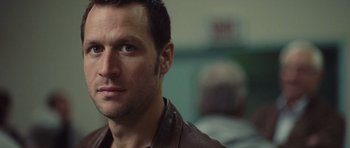 Movie still from “Café de Flore” (2011), directed by Jean-Marc Vallée – A person wearing a leather jacket; Close Up shot, Over the shoulder angle