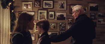 Movie still from “Café de Flore” (2011), directed by Jean-Marc Vallée – A man and a boy in front of a brick wall; Medium shot, Over the shoulder angle