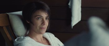 Movie still from “Café de Flore” (2011), directed by Jean-Marc Vallée – A person sitting in front of a mirror; Close Up shot, Over the shoulder angle