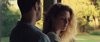 Movie still from “Café de Flore” (2011), directed by Jean-Marc Vallée – A man and a woman standing next to each other near a window; Close Up shot, Over the shoulder angle