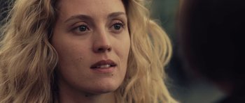 Movie still from “Café de Flore” (2011), directed by Jean-Marc Vallée – A woman's face with blonde hair; Close Up shot, Over the shoulder angle