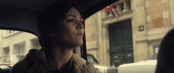 Movie still from “Café de Flore” (2011), directed by Jean-Marc Vallée – A woman sitting in a car looking out of the window; Close Up shot, Over the shoulder angle