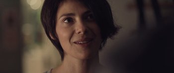 Movie still from “Café de Flore” (2011), directed by Jean-Marc Vallée – A person with short hair; Close Up shot, Over the shoulder angle